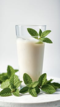 Glass of Milk with Fresh Mint Leaves photo