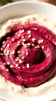 Closeup of Beetroot Hummus with Sesame Seeds photo