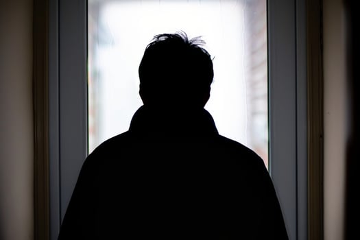 Young person standing in front of door decision making deciding entering light welcome guest concept real estate career path choosing study choice possibility opportunities mortgage photo