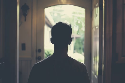 Young person standing in front of door decision making deciding entering light welcome guest concept real estate career path choosing study choice possibility opportunities mortgage photo