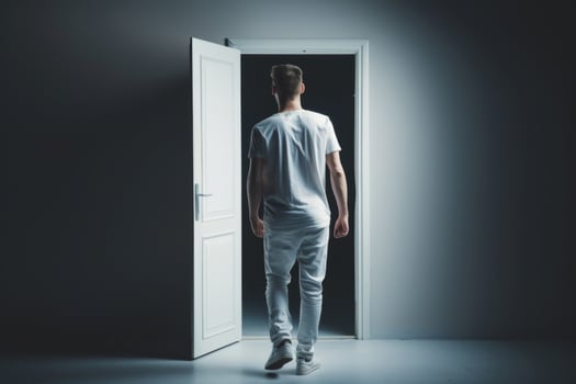 Young person standing in front of door decision making deciding entering light welcome guest concept real estate career path choosing study choice possibility opportunities mortgage photo
