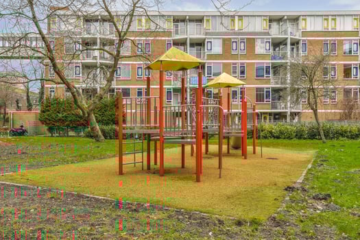 A playground in front of a building photo
