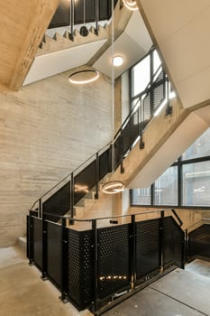 The interior of a building with a staircase and a light fixture photo