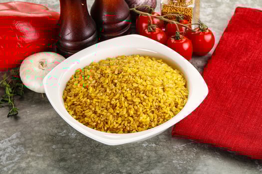 Dry wheat bulgur cereal heap photo