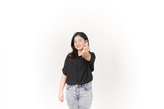 Young Asian woman Showing korean love finger wearing Black t-shirt and jeans isolated on white background photo