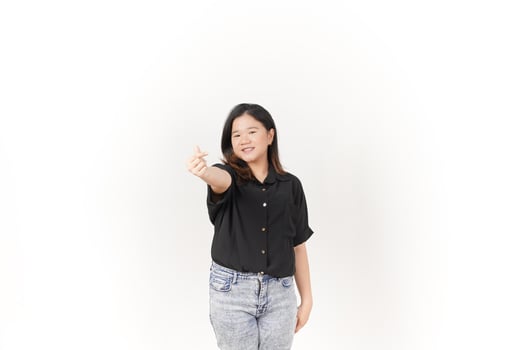 Young Asian woman Showing korean love finger wearing Black t-shirt and jeans isolated on white background photo