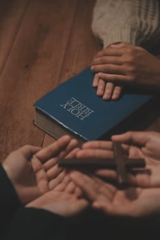 Christian group are praying to god with the bible and sharing the gospel. Concept of faith for god. photo