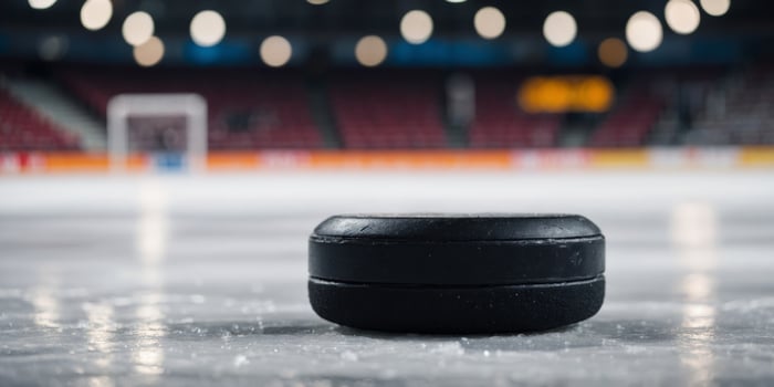 Close-up of a hockey puck on the ice in a stadium. photo