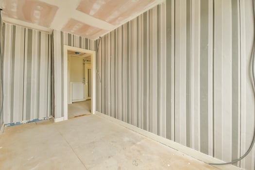 A room with a striped wall and a door photo