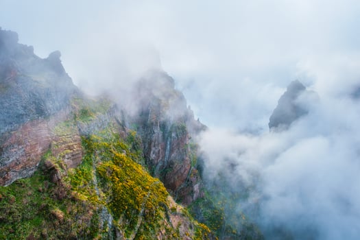 A mountain covered in fog and clouds. Madeira island, Portugal photo