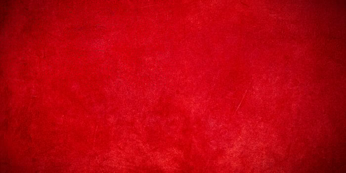 Red suede background. A thin focal part of the red background photo