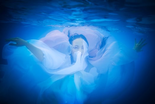 Underwater close up portrait of a woman photo