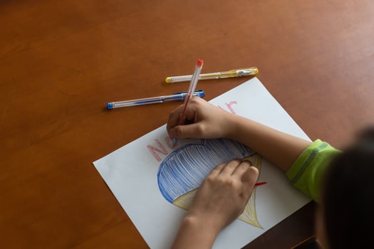 Ukrainian flag and a heart in yellow and blue color. Child draws a heart on the blackboard photo