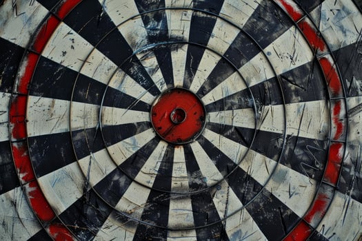 Old weathered dartboard showing signs of wear and tear photo