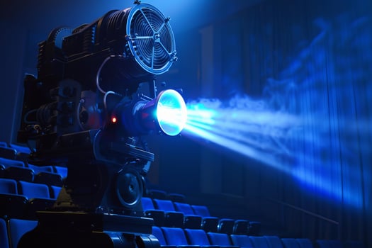 Vintage movie projector casting light beam in empty theater photo