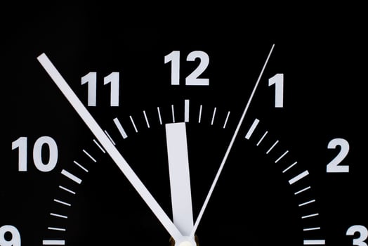 Alarm clock still photo in studio. Concept of time and working with valuable time.