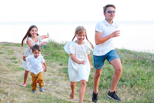 Kids playing and running in the park photo