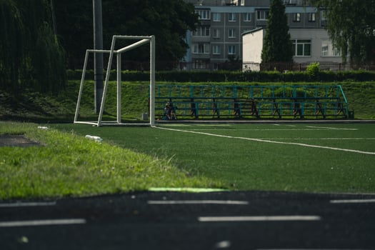 The school stadium, football gates on the field. Rubber Treadmill photo