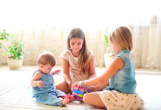 Three cute girl playing together photo