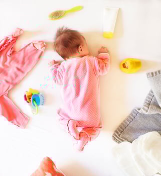 Baby girl is sleeping on the bed photo