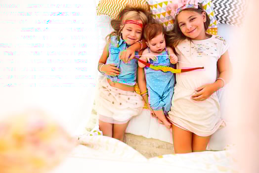 Three cute girl playing together photo