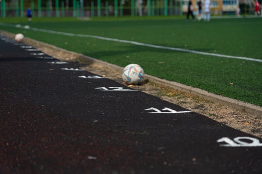 Marking the rubber track of the stadium. Meters on the treadmill. School Stadium photo