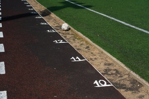Marking the rubber track of the stadium. Meters on the treadmill. School Stadium photo