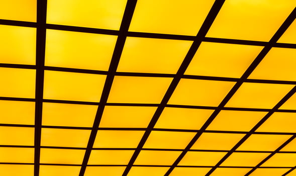Black line on yellow isolate background, Metal grid painted in black isolated on yellow , Create visual impact with graphic patterns and ink splatters. Diagonal cells pattern. Seamless. photo