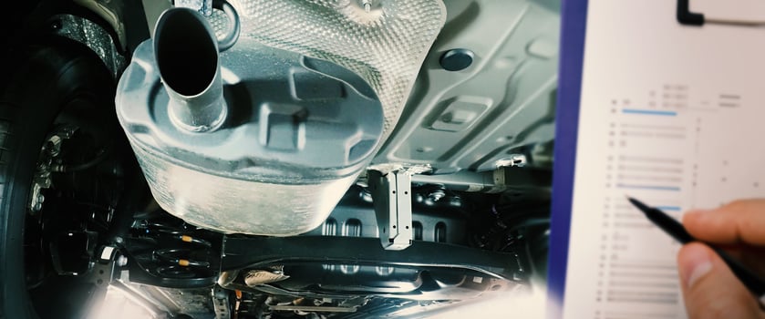Under car exhaust pipe and suspension. Automotive mufflers. Inspection of car for Defects. Metal fittings and pipes for the muffler. Suspension elements and exhaust system. Auto parts and car service photo