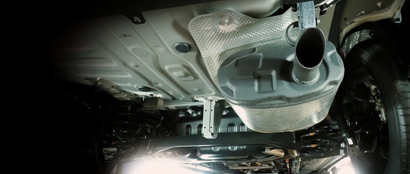 Under car. exhaust pipe and suspension. Automotive mufflers. Inspection of car for Defects. Metal fittings and pipes for the muffler. Suspension elements and exhaust system. Auto parts and car service photo