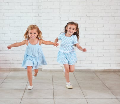 Two small girls playing indoors photo