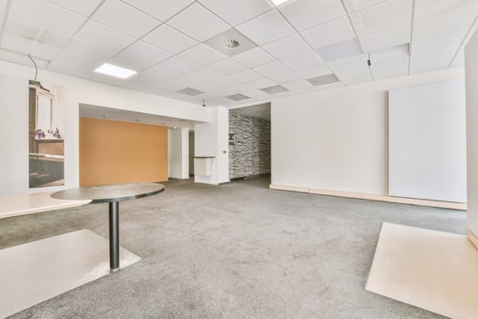 An empty office with a table and chairs photo