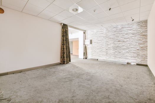 An empty room with a wall of stone tiles photo