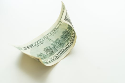Bill in one hundred dollars isolated on white background. photo