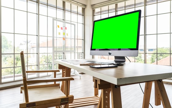 Modern office interior, Luxury office, Blank computer desktop with keyboard, paperwork and other accessories on wood table in sunny room, mock up photo
