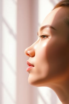 Close-up of a Woman's Face with Sunlit Skin photo