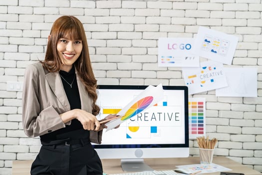 Young asian woman graphic designer working in office. Artist Creative Designer Illustrator Graphic Concept, corporate women in creative marketing team working on project management, looking camera photo