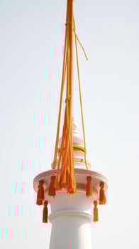 White Column with Orange Tassels photo