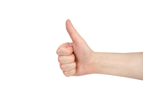 The man's hand showing thumbs up sign isolated on white background. Close-up. photo