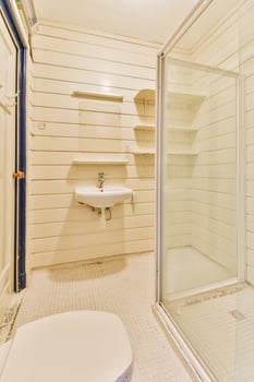 A bathroom with a shower and a sink photo