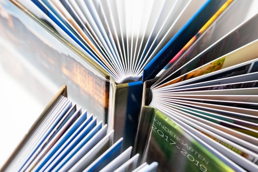 Colored spines of books lying on top of each other. Selective Focus. photo