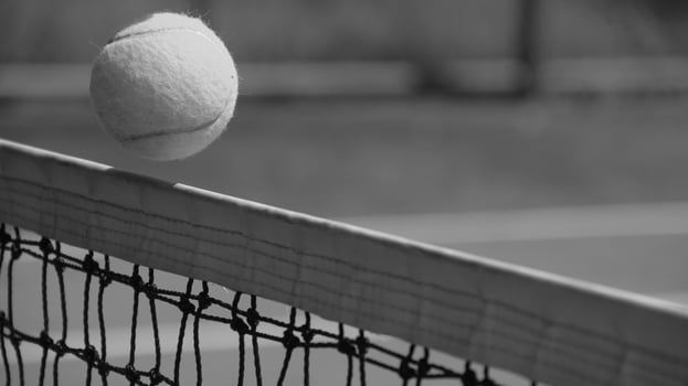 Tennis ball on blue tennis court. the concept of a sporty lifestyle. photo