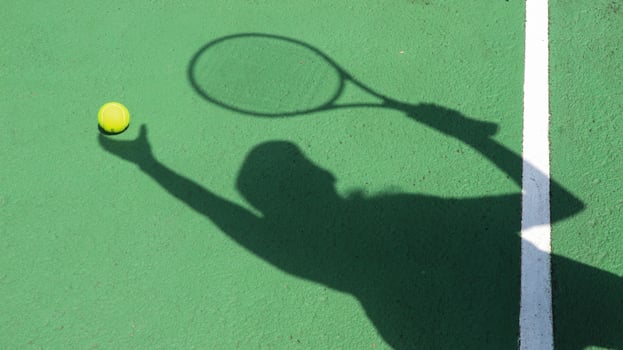 Tennis ball on blue tennis court. the concept of a sporty lifestyle. photo