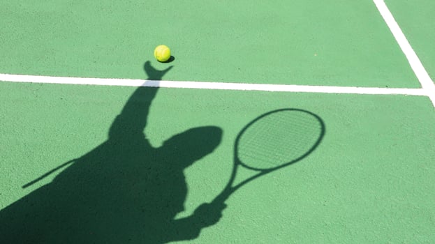 Tennis ball on blue tennis court. the concept of a sporty lifestyle. photo