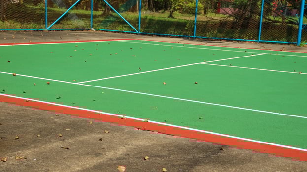 Tennis ball on blue tennis court. the concept of a sporty lifestyle. photo