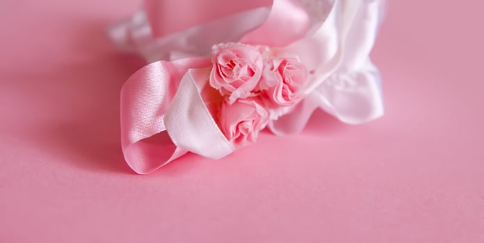 The bride's garter on a pink background. photo