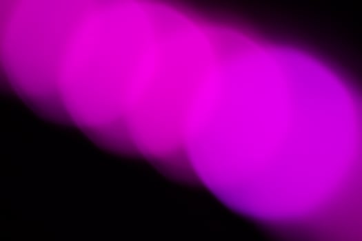 Blurred lights with purple bokeh effect Background photo