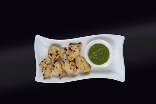 Fried Chicken and green chutney isolated view photo