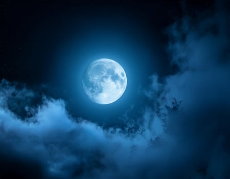 Full moon illuminating a dark, cloudy night sky with dense blue fog. Halloween background , nighttime ambiance, lunar light concept, gothic aesthetic, eerie atmosphere. photo