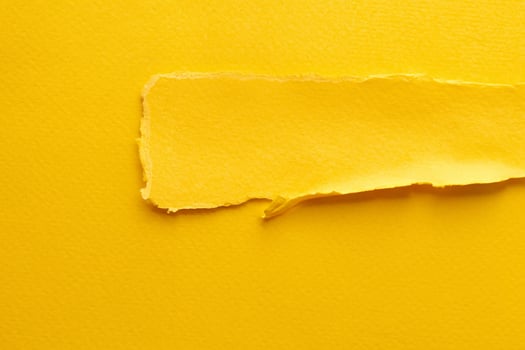 Abstract Art Collage of Torn Paper and Sticky Notes in Yellow Tones photo